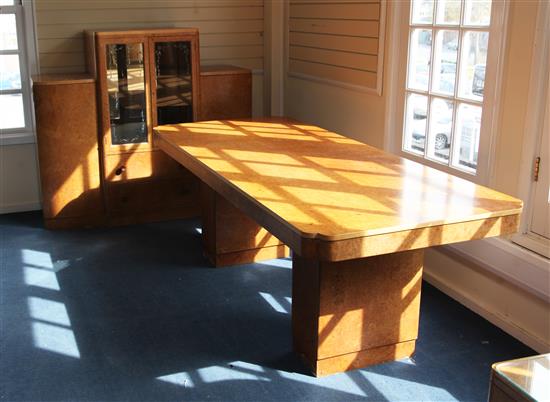 An Art Deco birds eye maple dining table and cabinet